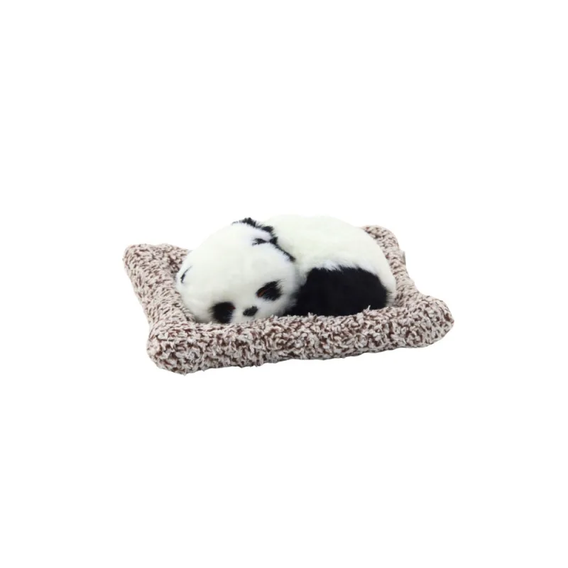 Mieganti panda ant pagalvėlės permatomame krepšelyje · 2